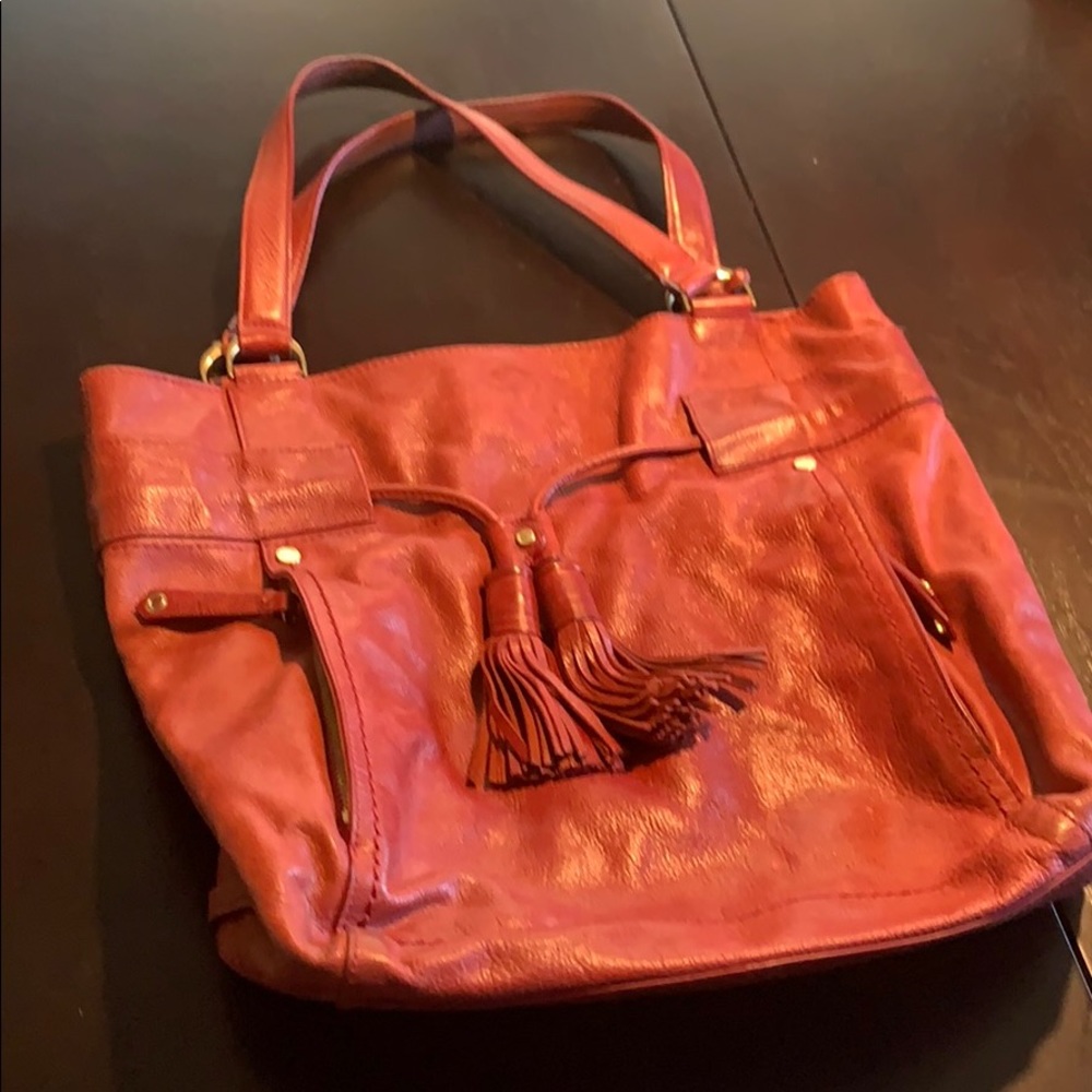 Red Cole Haan purse with lots of storage.